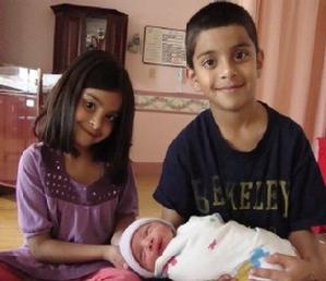 Baby Yusuf with his sister Amina and brother Hamza