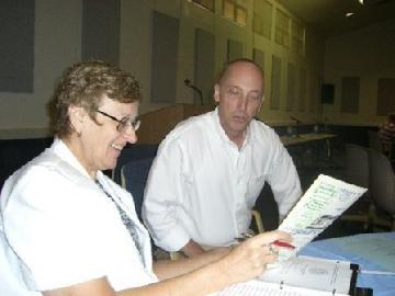 Photo Above:  (From Left) Professor Mary Francis & Fr. Scott viewing the Al-Hikmat Monthly Muslim Magazine.